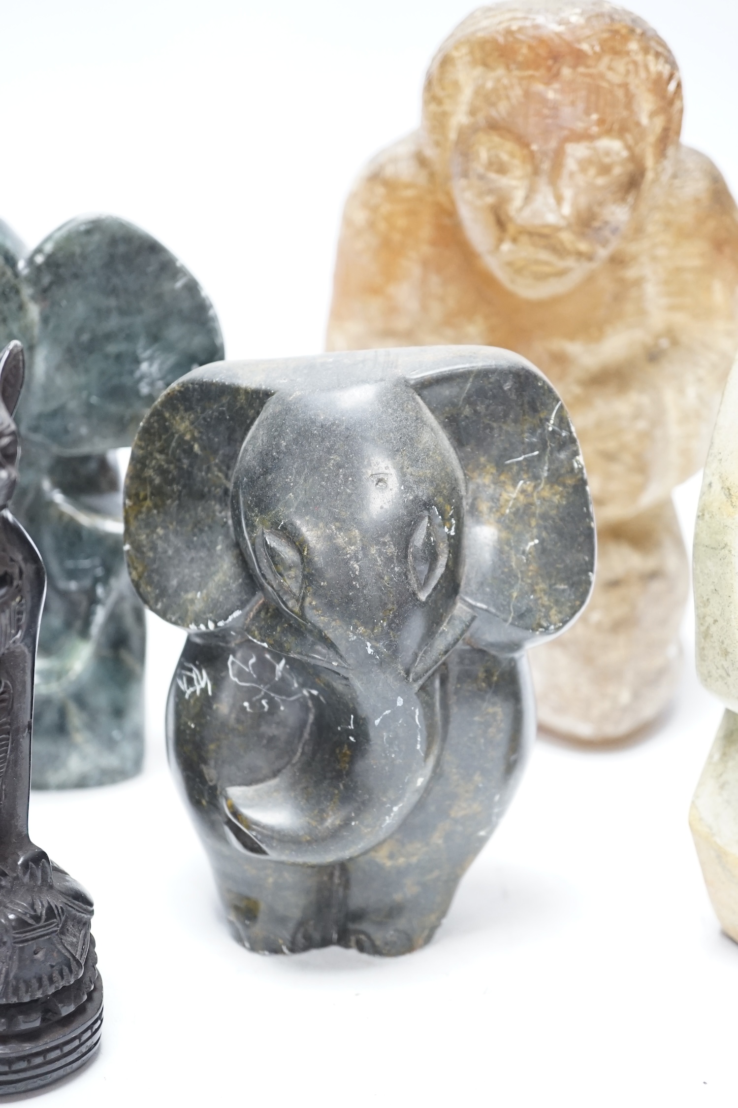 Six soapstone and marble carvings of Inuit figures, elephants, an Egyptian style cat, etc. tallest 22.5cm